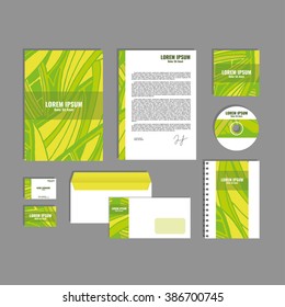 Corporate identity template with hand drawn yellow and green exotic tropical leaf
pattern, creative stationery branding mock-up set of separated, movable objects. EPS 10.