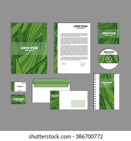 Corporate identity template with hand drawn green exotic tropical leaf pattern, creative stationery branding mock-up set of separated, movable objects. EPS 10.