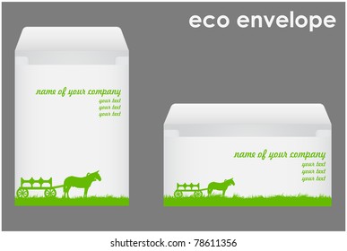 Corporate kit consisting of two envelopes placed on them with grass and a horse and wagon