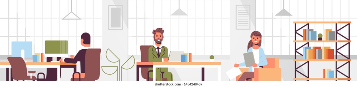 corporate staff employees working in creative co-working open space coworkers businesspeople sitting at workplace and discussing new project modern office interior flat portrait horizontal