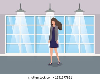 corridor building with businesswoman walking