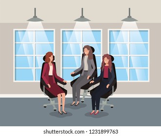 corridor office with businesswomen sitting