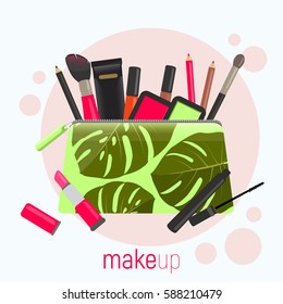 Cosmetic bag with a pattern of tropical leaves. Cosmetic bag with tools for professional make-up: lipstick, mascara, eyeshadow and cosmetic brush.