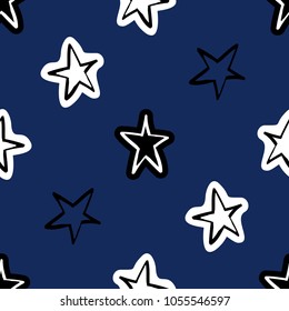 Cosmos patches seamless pattern design with cute little stars in doodle style. Cute kids cosmic print on black blue background.