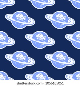 Cosmos patches seamless pattern design with saturn planet in doodle style. Cute kids cosmic print on black blue background.