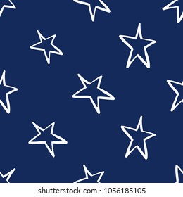 Cosmos patches seamless pattern design with little star in doodle style. Cute kids cosmic print on black blue background.