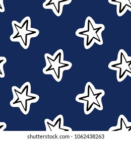 Cosmos patches seamless pattern design with star in doodle style. Cute kids cosmic print on black blue background.
