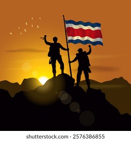 Costa Rica flag, silhouette of two climbers holding flags at sunset