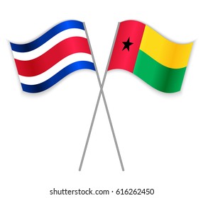Costa Rican and Bissau-Guinean crossed flags. Costa Rica combined with Guinea-Bissau isolated on white. Language learning, international business or travel concept.
