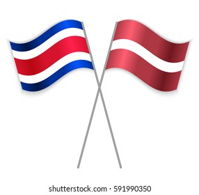 Costa Rican and Latvian crossed flags. Costa Rica combined with Latvia isolated on white. Language learning, international business or travel concept.