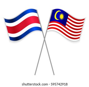 Costa Rican and Malaysian crossed flags. Costa Rica combined with Malaysia isolated on white. Language learning, international business or travel concept.