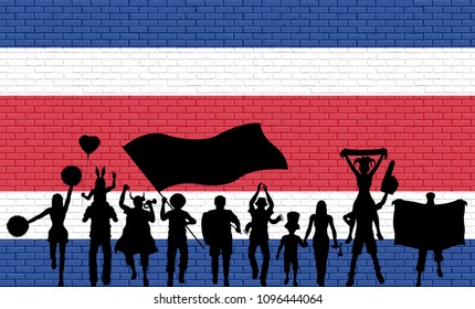 Costa Rican supporter silhouette in front of brick wall with Costa Rica flag. All the objects, silhouettes and the brick wall are in different layers. 
