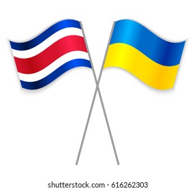 Costa Rican and Ukrainian crossed flags. Costa Rica combined with Ukraine isolated on white. Language learning, international business or travel concept.