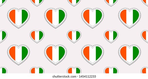 Cote d'Ivoire flags background. Vector stickers. Love hearts symbols. Ivorian flag seamless pattern. Good choice for sports pages, travel, patriotic, geographic, elements. patriotic wallpaper.