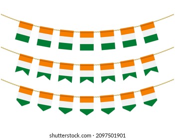 Cote d'ivoire - Ivory Coast flag on the ropes on white background. Set of Patriotic bunting flags. Bunting decoration of Cote d'ivoire - Ivory Coast flag