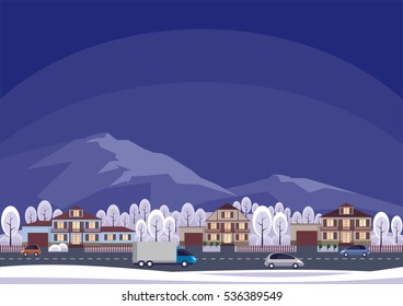 The cottage settlement against the background of mountains. Winter landscape