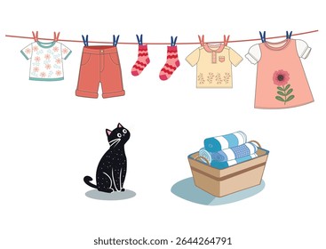 Cotton children clothes drying on a line and hanging with clothespins. Under the line is a laundry basket with clean towels.  Washed laundry