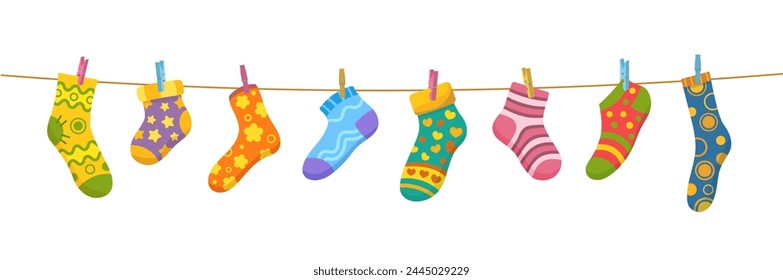 Cotton and wool socks on clothesline. Socks hanging on a rope with clothespins, vector cute baby laundry. Cartoon foot clothes with color hearts, stars, stripes and flowers pattern drying on string