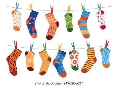 Cotton and woolen socks in various patterns hang on lines to dry. Fashionable clothing accessories. Vector illustration