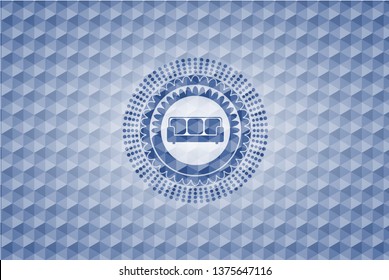couch icon inside blue hexagon emblem.