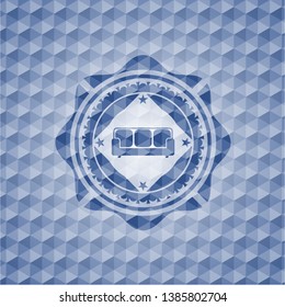 couch icon inside blue polygonal emblem.