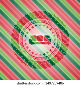 couch icon inside christmas badge background.