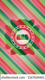couch icon inside christmas colors badge.