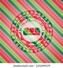 couch icon inside christmas emblem.