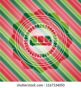 couch icon inside christmas style emblem.