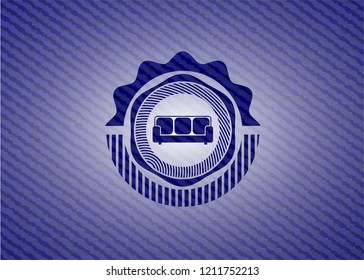 couch icon inside emblem with denim high quality background