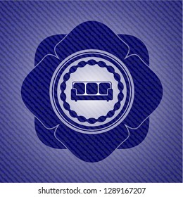 couch icon inside emblem with denim high quality background
