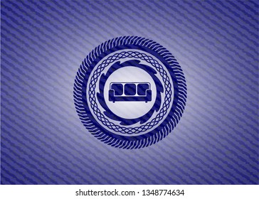 couch icon inside emblem with denim high quality background