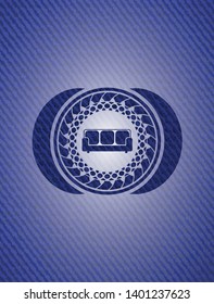 couch icon inside emblem with denim high quality background