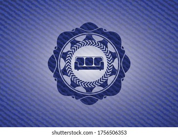 couch icon inside emblem with jean texture. 