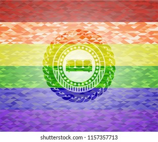 couch icon inside emblem on mosaic background with the colors of the LGBT flag