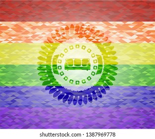 couch icon inside emblem on mosaic background with the colors of the LGBT flag