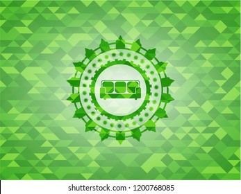 couch icon inside green emblem with mosaic ecological style background