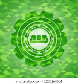 couch icon inside green emblem with mosaic background