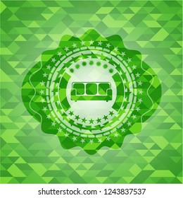 couch icon inside green emblem with mosaic background