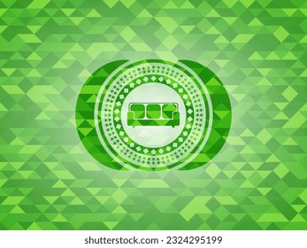 couch icon inside green emblem with triangle mosaic background. 