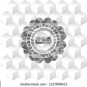 couch icon inside grey badge with geometric cube white background