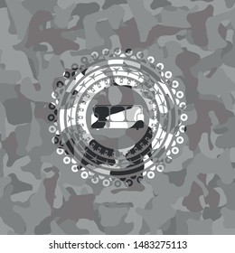 couch icon inside grey camouflaged emblem