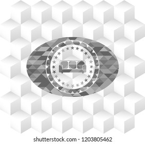 couch icon inside grey emblem with cube white background