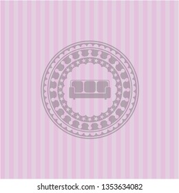couch icon inside pink emblem