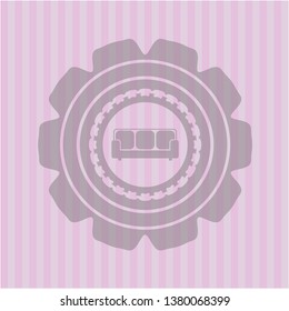 couch icon inside pink emblem