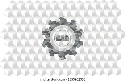 couch icon inside realistic grey emblem with geometric cube white background