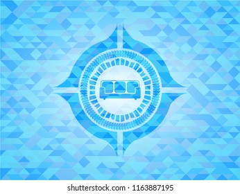 couch icon inside realistic light blue mosaic emblem