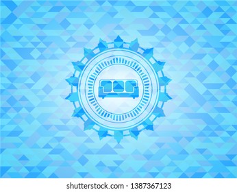 couch icon inside realistic light blue mosaic emblem