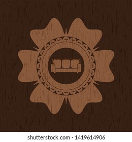 couch icon inside realistic wood emblem