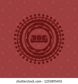 couch icon inside red emblem